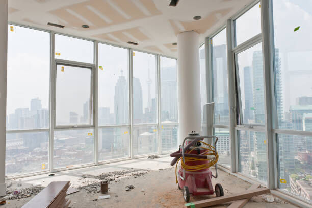 Image of a renovated space with a cleaner finishing up.